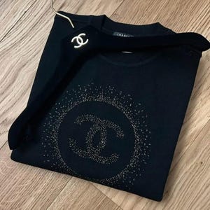 Chanel uniform CC sweater with gold inlaid in the mesh