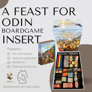 Może przedstawiać: Wkładka do gry planszowej Feast for Odin z niebiesko-białym pudełkiem, czarną wkładką z przegródkami na elementy gry i etykietą z napisem "Made in Germany".