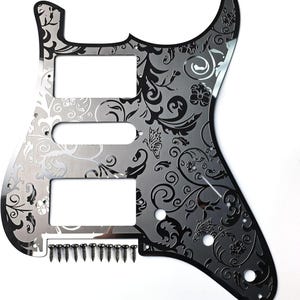 May include: A decorative guitar pickguard with a floral and butterfly design. The pickguard is silver with black etched details. Includes mounting screws.