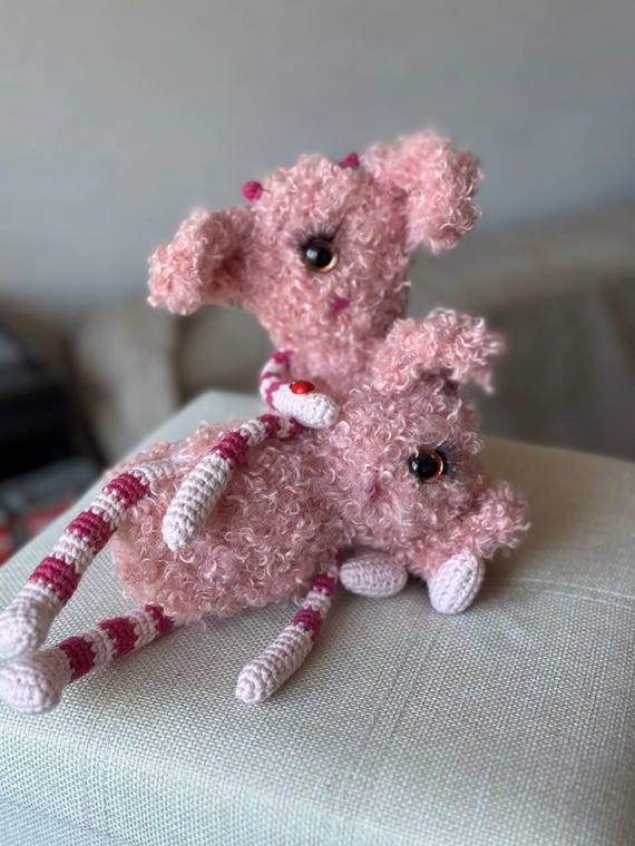 A one-eyed fluffy bouclé monster hand-crocheted by an actual maker — the kind of weird-cute desk creature that sparks instant 'where did you GET that?' reactions.