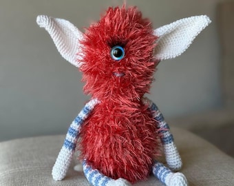 Handmade Crochet Cyclops Toy: Quirky Coral Red Monster, 8-Inch Fuzzy Amigurumi Doll.