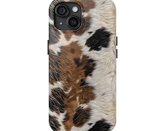 May include: A smartphone case featuring a cowhide pattern. The case has a black border and a design of brown, black, and white patches, mimicking the look of animal fur. The camera lenses are visible at the top.