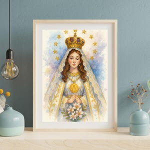 May include: Watercolor print of a woman with a crown and veil, surrounded by stars. She wears a gold necklace and holds white flowers. The artwork is framed in a light wood frame and set against a blue background.