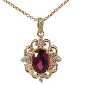 Vintage Inspired 14K Yellow Gold Pendant with Natural White Diamonds and an Oval Tanzanian Garnet with Deep Rich Colour