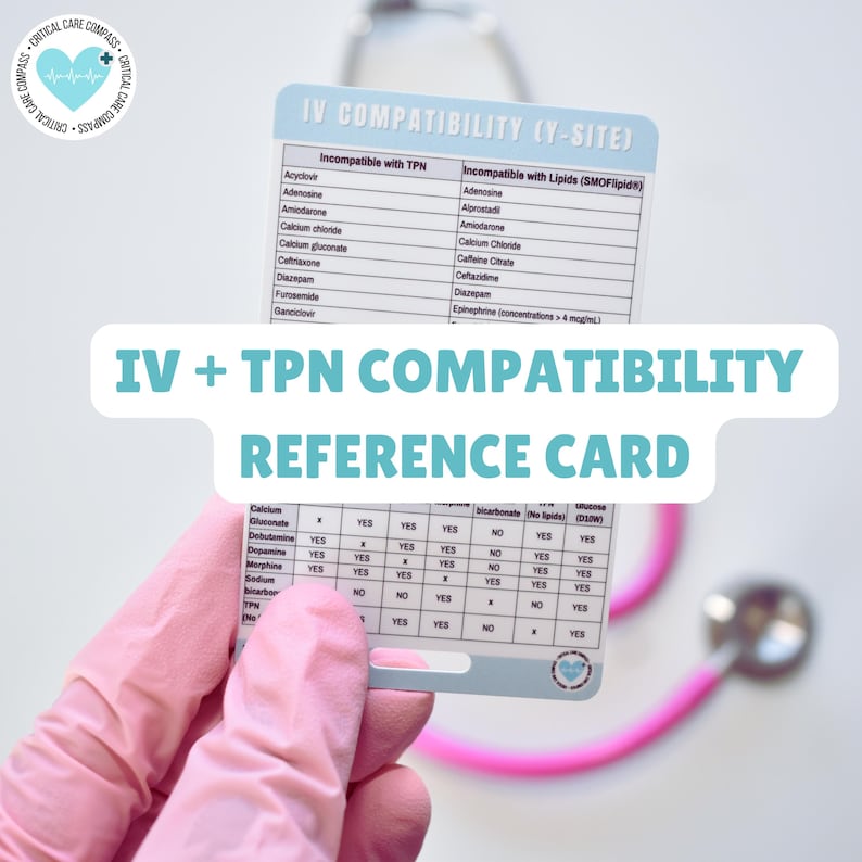 May include: A white card with the title "IV + TPN Compatibility Reference Card" and a table listing medications and their compatibility with IV and TPN solutions. The card is being held by a gloved hand, with a pink stethoscope in the background.