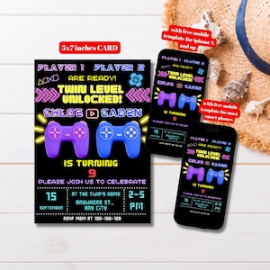 May include: A black invitation card with a gaming theme, featuring purple and blue game controllers and the text "Twin Level Unlocked!" The card is 5x7 inches and includes party details. Two smartphones display the same design.