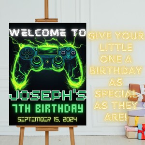 May include: A welcome sign for a 7th birthday party with a green and black video game controller graphic. The sign says "Welcome to Joseph's 7th Birthday September 15, 2024".