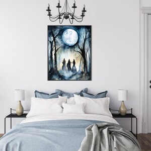 May include: A watercolor painting of three figures in hooded robes walking through a forest under a full moon. The figures are silhouetted against the moon and the trees. The painting is framed in black.