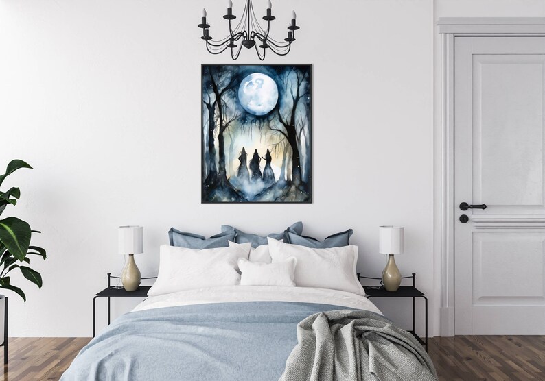 May include: A watercolor painting of three figures in hooded robes walking through a forest under a full moon. The figures are silhouetted against the moon and the trees. The painting is framed in black.