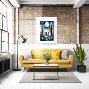 May include: A watercolor painting of three figures walking through a forest under a full moon. The painting is framed in a white frame and hanging on a brick wall above a yellow sofa.
