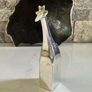 Gunnar Cyren Silverplated Dansk Giraffe, Japan Vintage 1980s Approx 4.13” x 1.13” x .75” Good overall condition, no visible scratches