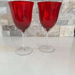 Pair of Murano Art glass ruby red clear ripped stemmed vintage handblown wine goblets. MCM  home decor. Approx 7.75” tall. 10 oz.