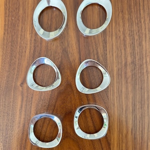 Vintage Art Deco/ Modern napkin rings. Set of 6 with 3 different geometric asymmetrical. Polished silver, no visible scratches or nicks.