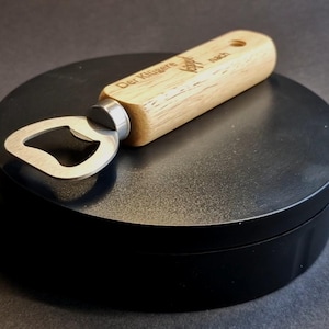 Bottle opener - wooden handle - cap lifter - with engraving &quot;The cleverer one tips over&quot;