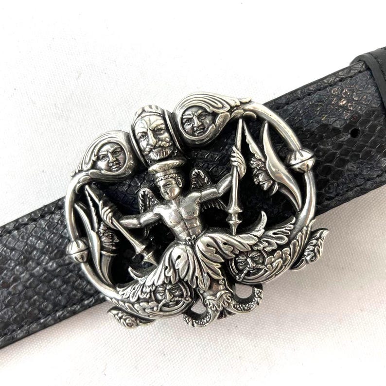 May include: A set of three ceramic mugs with a speckled, matte finish. The mugs are in shades of cream, light gray, and dark gray. Each mug has a simple, minimalist design and a rounded handle.