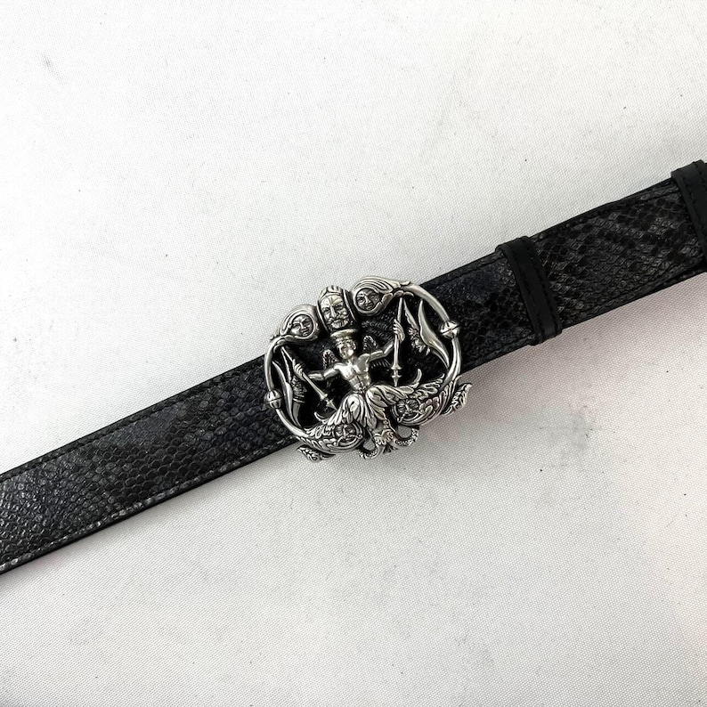 May include: A set of three ceramic mugs with a speckled, matte finish. The mugs are in shades of cream, light gray, and dark gray. Each mug has a simple, minimalist design and a rounded handle.