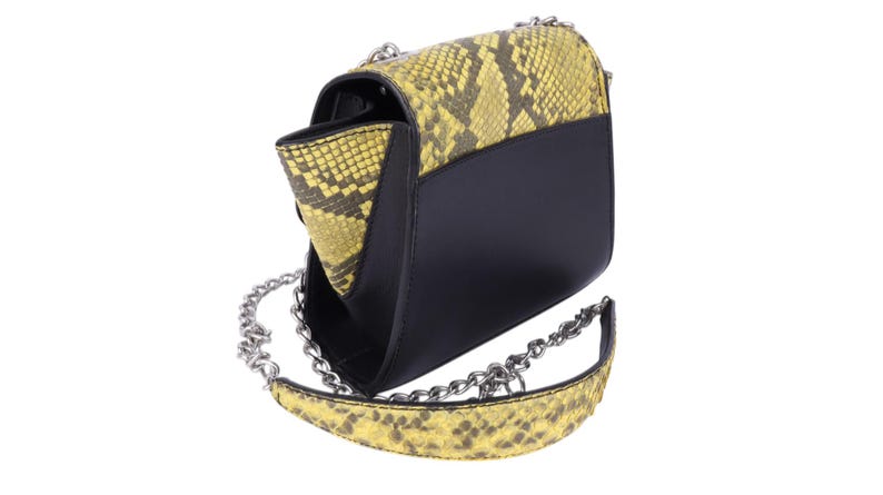 May include: Black and yellow snakeskin-patterned shoulder bag with a silver chain strap. The bag has a flap closure and a black body. The snakeskin pattern is yellow and brown.