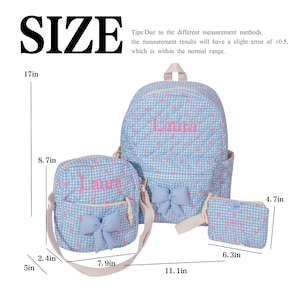 May include: A light blue backpack, crossbody bag, and small pouch set. The bags have a gingham pattern with pink hearts and bows. The backpack is 17 inches tall, the crossbody bag is 8.7 inches tall, and the pouch is 4.7 inches tall. The name "Laura" is embroidered on each bag.
