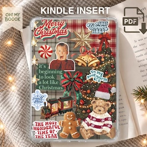 May include: A clear Kindle insert featuring a collage of Christmas-themed stickers including a gingerbread man, a teddy bear in a sweater, a train, a Christmas tree, bells, a star, and a portrait of a boy, with text reading Merry Christmas.