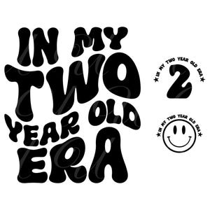 May include: Black and white graphic design with the text "IN MY TWO YEAR OLD ERA". Includes a number 2 and a smiley face with the text "IN MY TWO YEAR OLD ERA" around them.