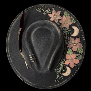 May include: A set of three ceramic mugs with a speckled, matte finish. The mugs are in shades of cream, light gray, and dark gray. Each mug has a simple, minimalist design, perfect for coffee or tea.