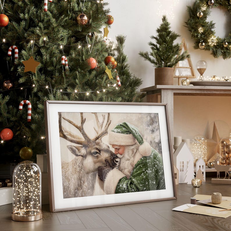 May include: A framed print of Santa Claus and a reindeer, with a green and white color scheme. The image is set against a Christmas tree background with ornaments and lights. The frame is a light brown color.