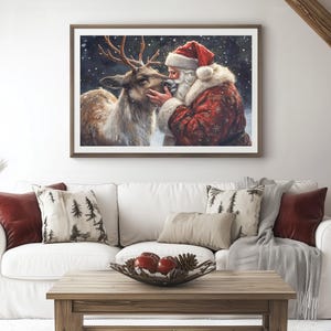 May include: A painting of Santa Claus with a reindeer. Santa is wearing a red suit with white trim and a white beard. The reindeer is brown and white with antlers. The background is a snowy forest.