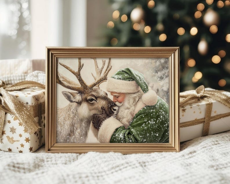 May include: A framed Christmas print featuring Santa Claus in a green suit and hat, embracing a reindeer. The artwork has a vintage style with a gold frame. The background includes a Christmas tree and wrapped gifts.