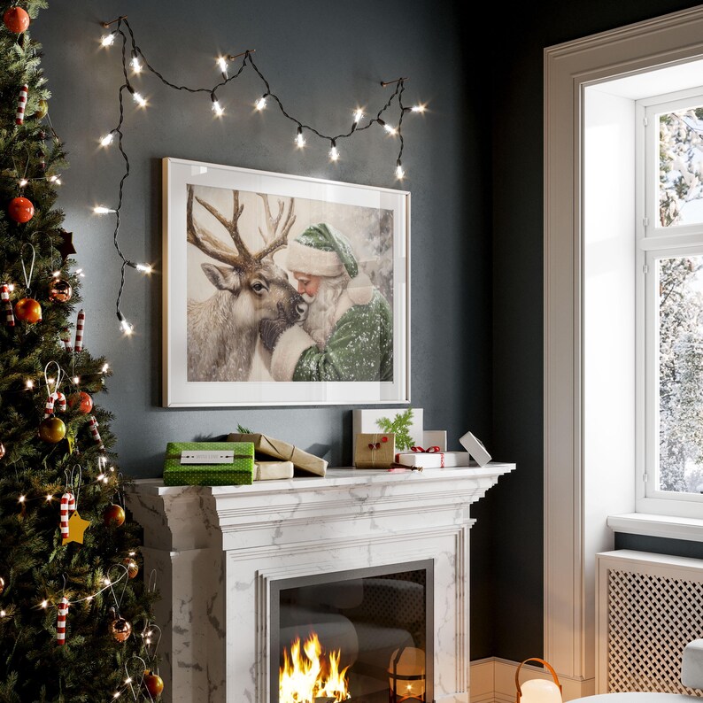 May include: A framed Christmas print depicts Santa Claus embracing a reindeer, set above a fireplace with a lit fire. A Christmas tree with ornaments and string lights is on the left. Several wrapped gifts and a string of lights are also visible.