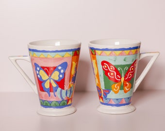 Juego de 2 tazas con diseño de mariposas de Baum Bros. con ojos estilo vintage