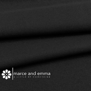 May include: Close-up of black fabric with a diagonal weave. The fabric is folded, creating shadows and texture. The image includes the text "marce and emma A LITTLE OF EVERYTHING".