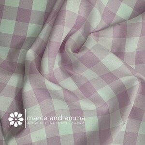 May include: Pink and white gingham fabric with a white flower and the text "marce and emma A LITTLE OF EVERYTHING" in the bottom left corner.