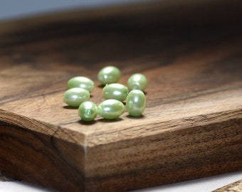 Bead, glass pearl, mint green, 8x6mm-9x6mm oval. Sold per pkg of 40.