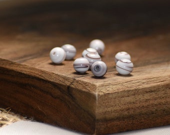 Bead, vintage Japanese glass, white and purple, 6-8mm round with stripes. Sold per pkg of 24.