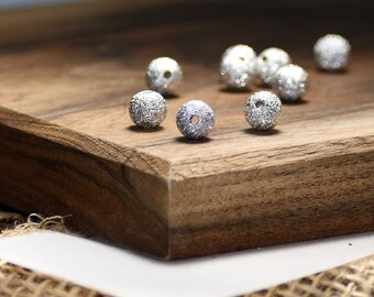 Bead, silver-plated brass, 8mm stardust round with 2.4mm hole. Sold per pkg of 12.