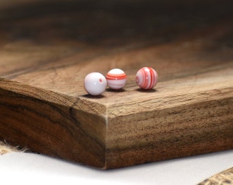 Bead, vintage Japanese glass, white and red, 6-8mm round with stripes. Sold per pkg of 24.