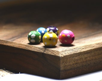 Bead mix, painted wood, mixed colors, 10mm irregular round with flower design. Sold per pkg of 100.