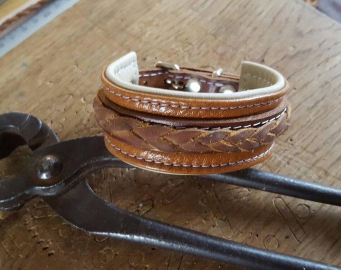 Handcrafted unisex tan on cream leather wrist cuff with leather braiding and buckle fastening