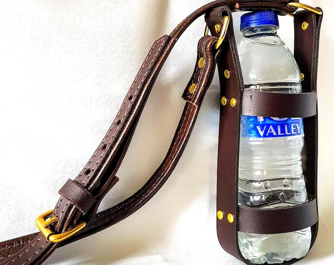 Hand crafted brown on brown leather water bottle carrier with solid brass hardware.
