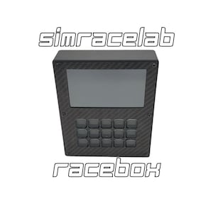 May include: A black simracelab racebox with a small screen and a keypad of buttons. The device has a carbon fiber texture.