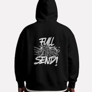 May include: Black hoodie with a white graphic on the back. The graphic features the words "FULL SEND!" in a bold, stylized font, accompanied by an illustration. The hoodie has a hood and a relaxed fit.