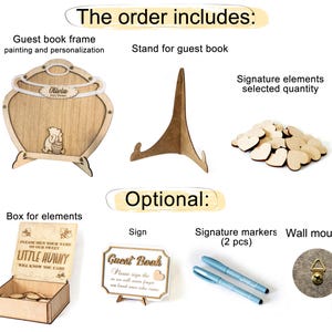 May include: A Winnie the Pooh themed guest book frame with a stand, a box for wooden heart signature elements, a sign that says "Guest Book", and two signature markers. The frame is personalized with the name "Olivia".