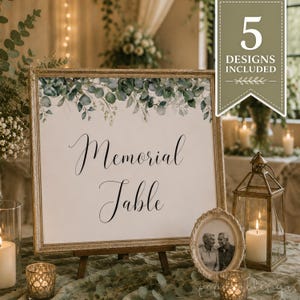 May include: A square sign in a gold frame featuring a green eucalyptus leaf border and the black text "Memorial Table". A green banner in the top right corner displays the white text "5 DESIGNS INCLUDED" with a decorative leaf graphic.