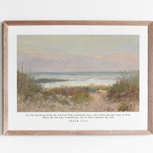 May include: A framed print with a painting of a seascape. The painting shows a beach with tall grasses and a view of the ocean. The print includes a quote from Psalm 143:8: "Let the morning bring me word of Your unfailing love, for I have put my trust in You. Show me the way I should go, for to You I entrust my life."