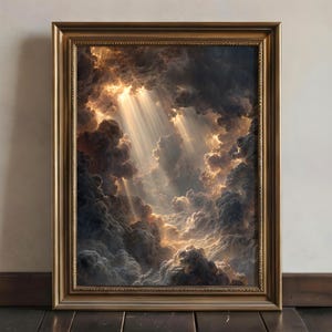 May include: A framed wall art print depicting a dramatic sky filled with dark, voluminous storm clouds. Bright golden sunlight breaks through the dense cloud cover, casting distinct, radiant beams of light downward into the shadowed atmosphere.