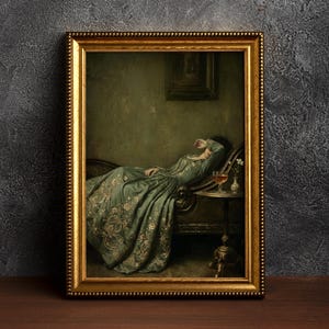 May include: A framed wall art print depicting a person in a long, sage green dress with floral embroidery reclining on a chaise lounge. The person has an arm raised to their face. A small side table holds a glass of liquid and a single white flower.