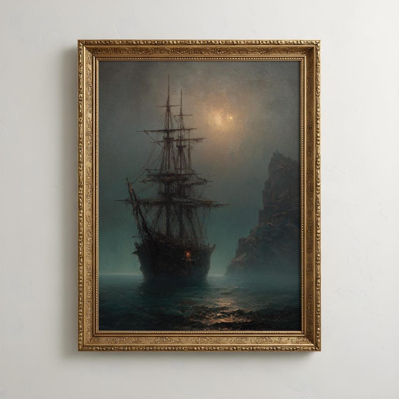 May include: A framed wall art print depicting a dark, multi-masted sailing ship on calm, misty water at night. A rocky cliff stands to the right under a dim, glowing moon. The ship features a single small, glowing red light on its hull.
