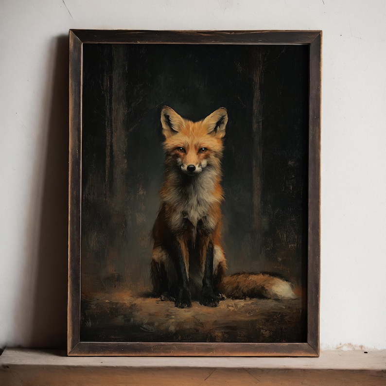 May include: A framed art print featuring a detailed painting of a fox. The fox has reddish-orange fur and is seated, facing forward against a dark forest background. The frame is dark brown.