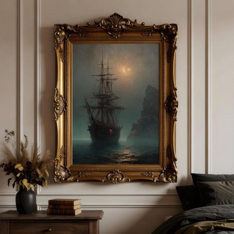 May include: A framed wall art piece featuring a dark, moody painting of a tall ship sailing on misty, dark waters near a rocky cliff under a dim, glowing moon. The artwork is encased in an ornate, antique-style gold frame with intricate carvings.