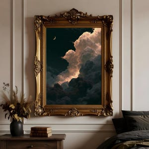 May include: A rectangular wall art piece featuring a dark night sky with a crescent moon and stars, illuminated by soft light on large, voluminous clouds. The artwork is encased in an ornate, antique-style gold frame with intricate carvings.